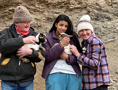 Terena and her Dad with Two Nigerian Dwarf Dairy Goats